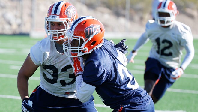 Outside linebacker Lawrence Montegut (33 in white) goes through practice at his new position during the second day of spring football pracitce for the UTEP Miners. With a new defense installed under a new coaching staff Montegut says he likes the new scheme because it gives a bigger challenge and the ability to showcase his talents.