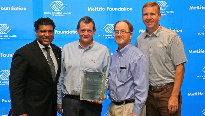 Bruce Daggy, David Woolpy and Jeff Sheridan of the Boys & Girls Clubs of Wayne County accept a Merit Award for Program Excellence in Healthy Lifestyles during the Boys & Girls Clubs of American's 110th national conference in New Orleans.