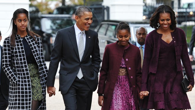 President Obama and his family on the way to church Oct. 27.