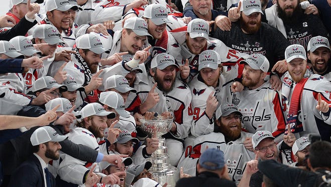 The Washington Capitals pose for a team photo with the Stanley Cup after a 4-3 victory in Las Vegas.