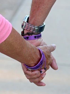 Bianka and Vern Landavazo walk home holding hands on