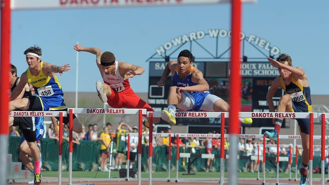 High school boys compete in the finals of the 100 meter dash at the 90th annual Dakota Relays at Howard Wood Field on Sat., May 2, 2015.