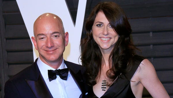 Amazon founder Jeff Bezos (L) and wife MacKenzie...