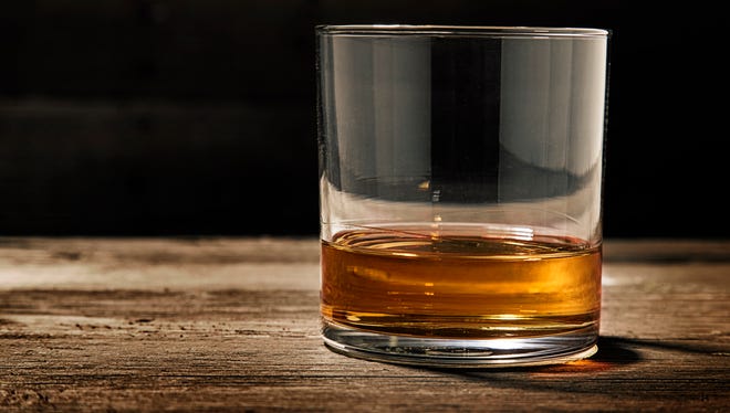 One single glass of straight bourbon, also known as neat