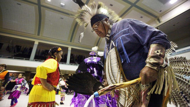 Charles WallowingBull dances during Native Americans' Day Wacipi at the Multi-Cultural Center of Sioux Falls on Monday, Oct. 12, 2015.
