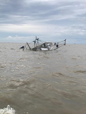 A  New Iberia man and two children were rescued from a sinking vessel in the Vermilion Bay Tuesday morning.