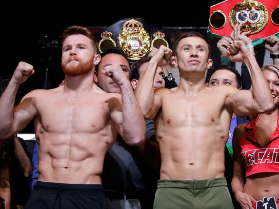 Canelo Alvarez, left, and Gennady Golovkin pose during a weigh-in Friday, Sept. 15, 2017, in Las Vegas. The two are scheduled to fight in a middleweight title fight Saturday in Las Vegas. (AP Photo/John Locher)