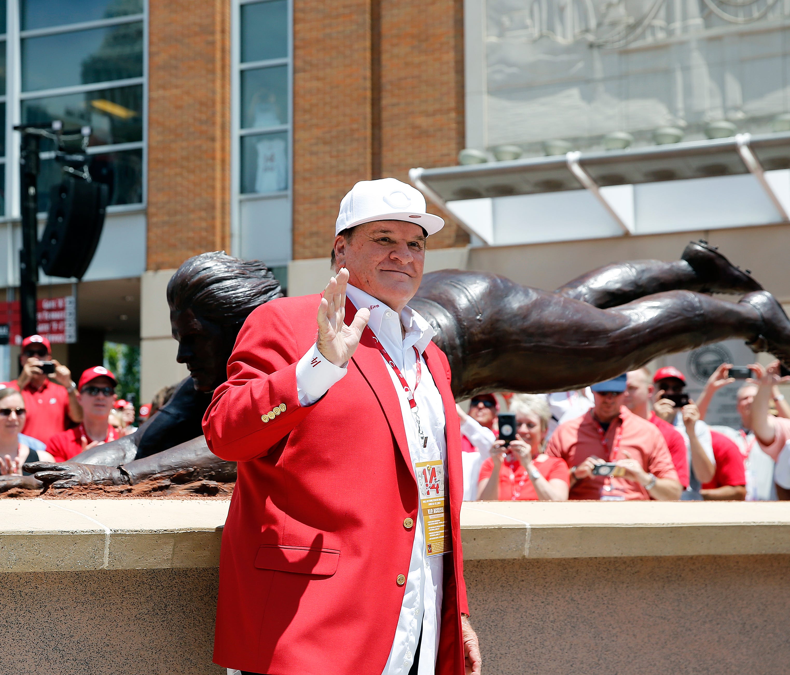 Pete Rose waves to his fans during the unveiling for a bronze statue dedicated to him at Great American Ball Park Saturday June 17, 2017.