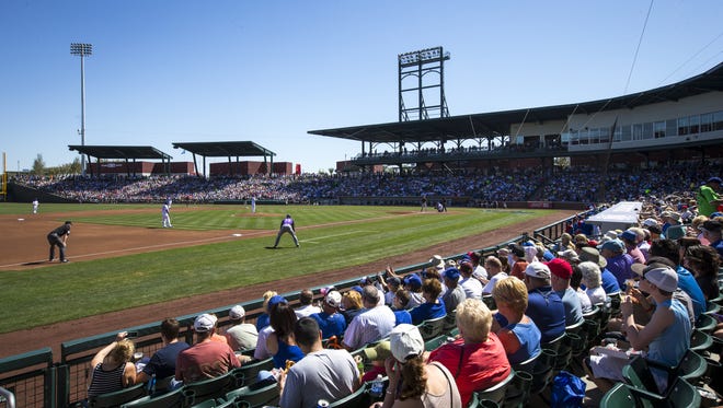 A sell-out crowd fills Cubs Park in Mesa, AZ, to watch the Chicago Cubs play the Colorado Rockies in a Cactus League game, Tuesday, March 11, 2014. The Cubs first venture in spring training in Mesa was at Rendezvous Park from 1952-65.