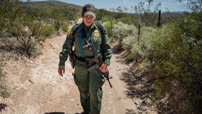 In this Aug. 30, 2016 photo, Lorena Apodaca patrols the area along the fence that makes up the U.S-Mexico border near the boot heel area in southern New Mexico.