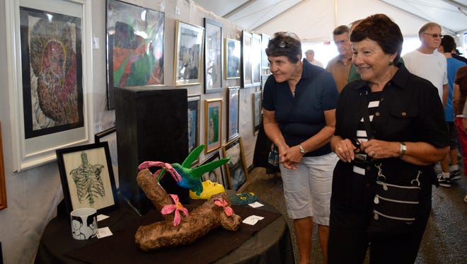 The public enjoys entries at a previous Art Under 20 exhibit.