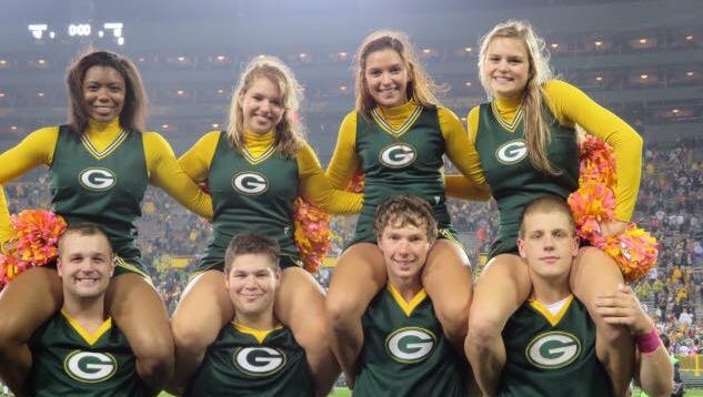 Tyler Brinkman, far right, is a member of the University of Wisconsin-Green Bay cheerleading squad that also performs at home games for the Green Bay Packers.