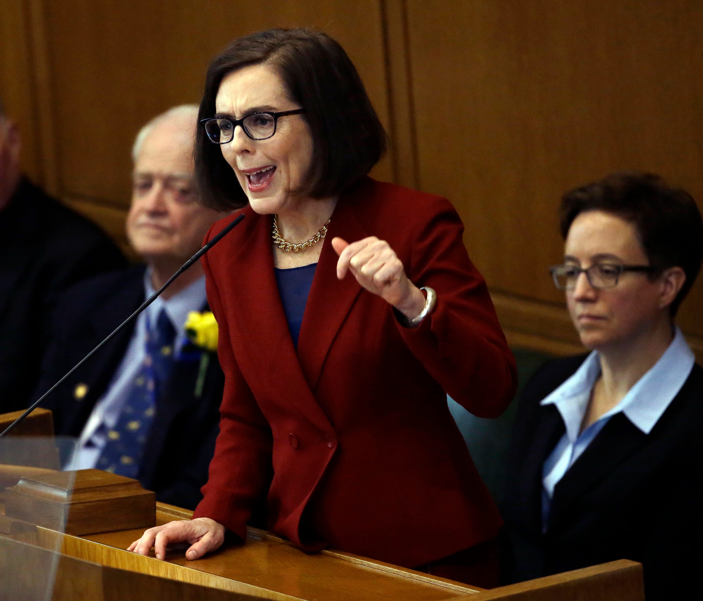 In this Jan. 9, 2017, file photo, Oregon Gov. Kate Brown delivers her inaugural speech in the Capitol House chambers in Salem, Ore. Fueled by anguished voices in the aftermath of the Florida high school shooting,