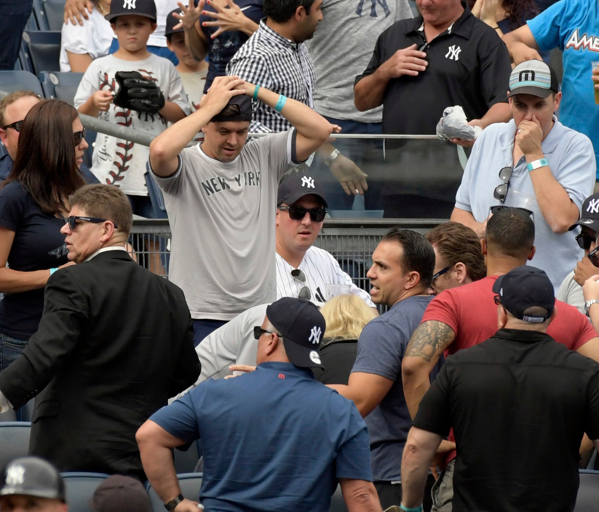Fans react after a young girl was hit by a line drive.