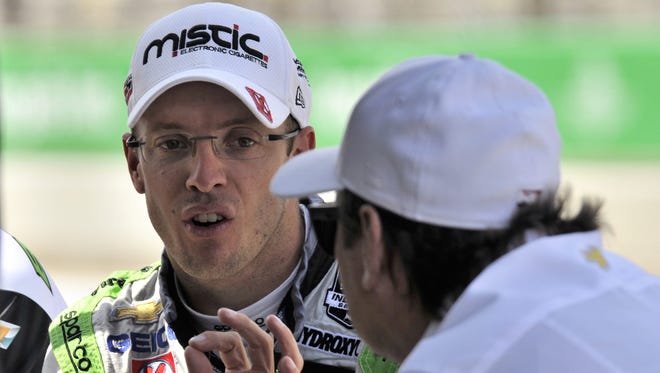 Sebastien Bourdais (seen here in May with team co-owner Jimmy Vasser) won Sunday's IndyCar race at the Milwaukee Mile