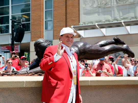 Pete Rose waves to his fans during the unveiling for a bronze statue dedicated to him at Great American Ball Park Saturday June 17, 2017.