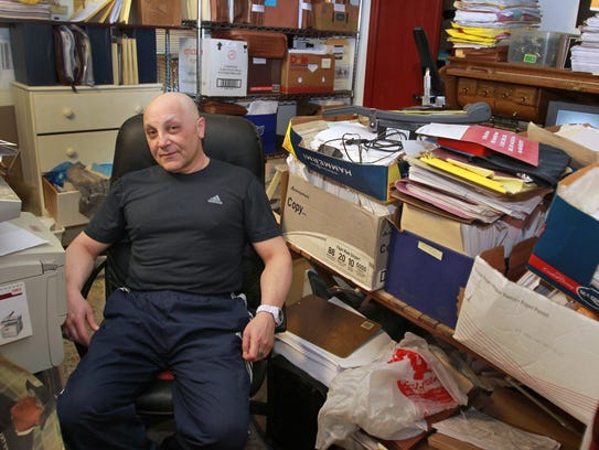 Gersh Zavodnik poses in a room in his home, Tuesday,