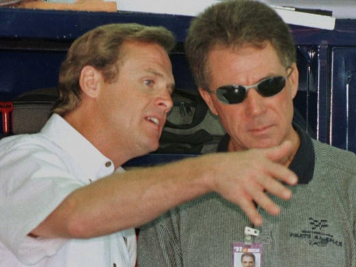 Rusty Wallace, left, confers with fellow driver Darrell