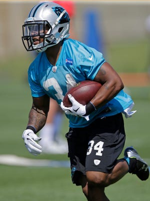 Carolina Panthers' Cameron Artis-Payne (34) runs a drill during a practice at the NFL football team's rookie minicamp in Charlotte, N.C., Friday, May 8, 2015.