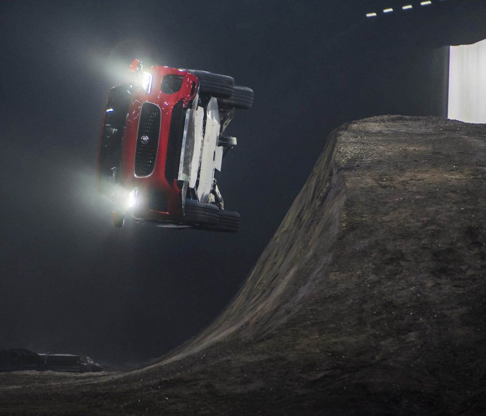 The 2018 Jaguar E-PACE compact crossover completes a 50-foot barrel roll at London's ExCeL venue, with stunt driver Terry Grant behind the wheel.