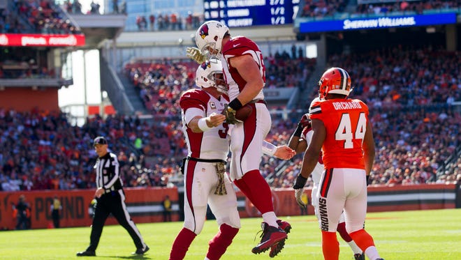 Nov 1, 2015: Arizona Cardinals tight end Troy Niklas (87) celebrates his touchdown reception with quarterback Carson Palmer (3) during the first quarter against the Cleveland Browns at FirstEnergy Stadium.