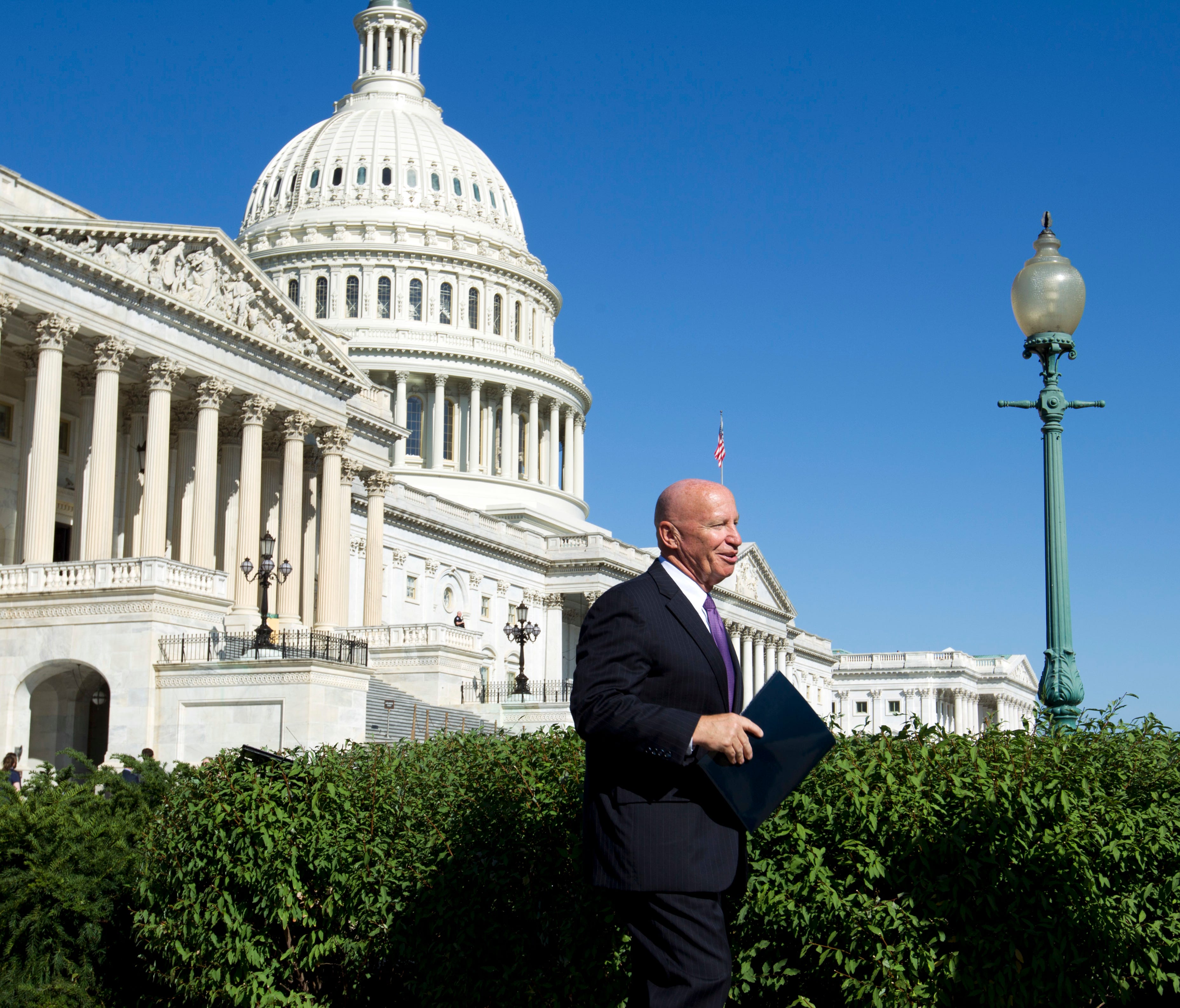 In this Sept. 28, 2017, file photo, House Ways and Means Chairman Kevin Brady, R-Texas, arrives for a news conference on Capitol Hill.