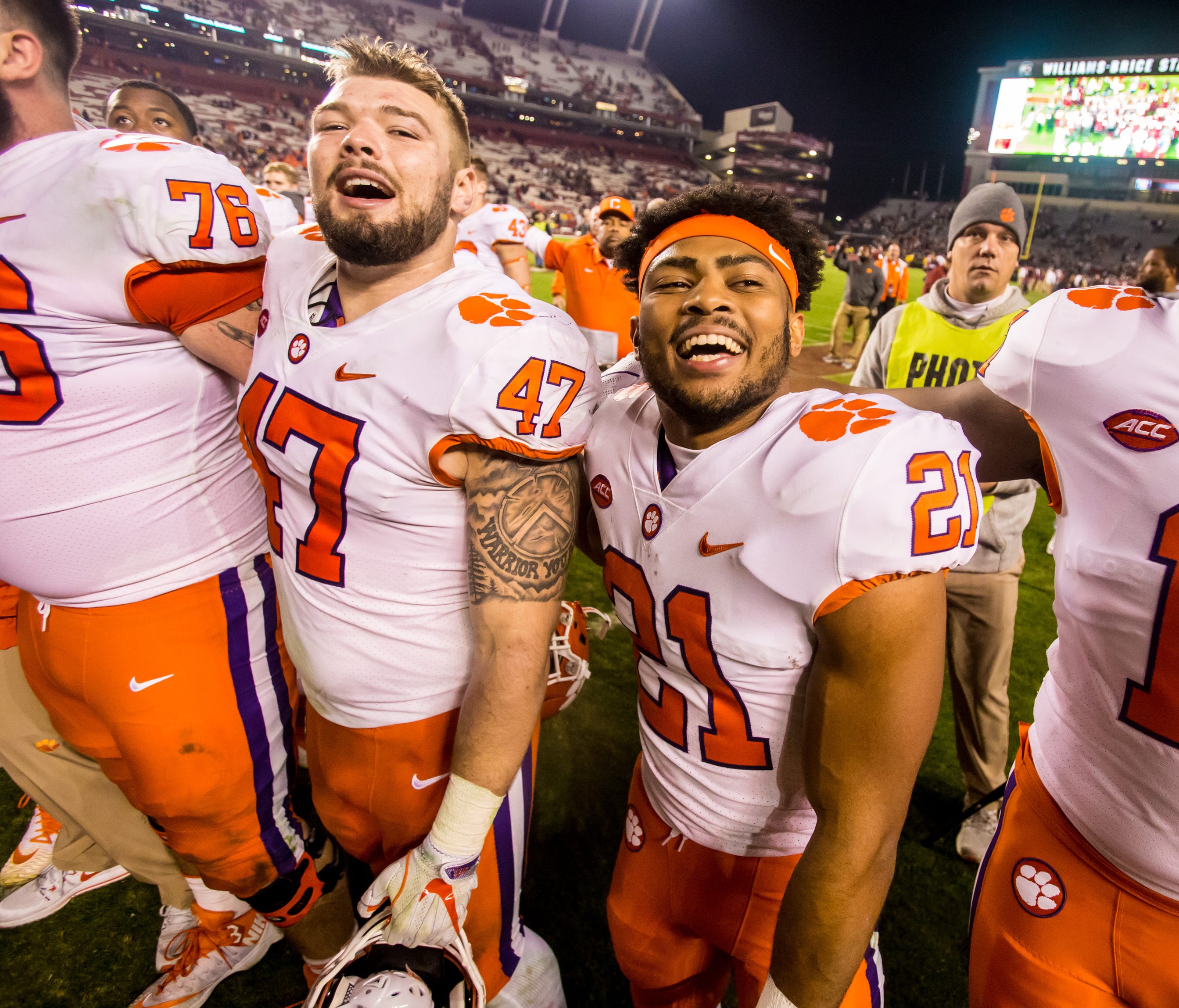 Clemson players celebrate following their win over the South Carolina at Williams-Brice Stadium.