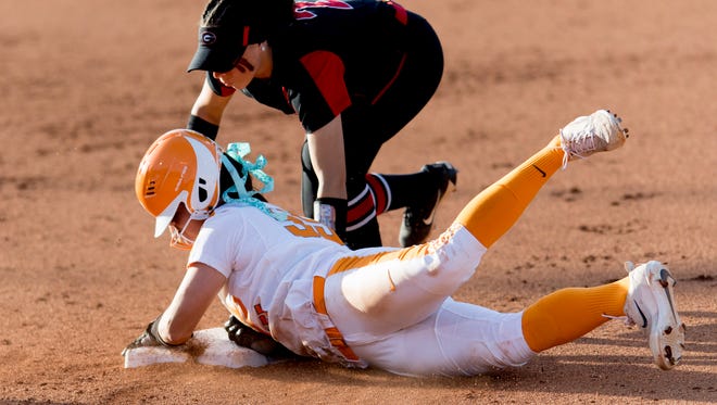 Tennessee infielder Meghan Gregg (55) slides safely into second as Georgia infielder Justice Milz (2) tries to out her during a game between Tennessee and Georgia at Sherri Parker Lee Stadium in Knoxville, Tennessee on Saturday, March 31, 2018.