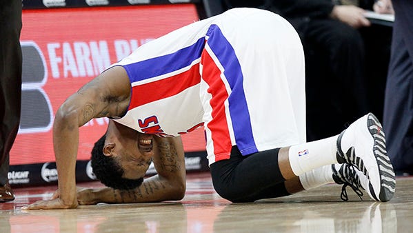 Kentavious Caldwell-Pope takes a knee to the thigh during Tuesday's game against the Raptors.