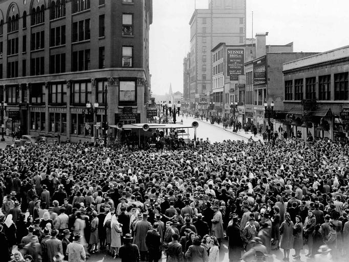 Crowds gather downtown Rochester after the surrender