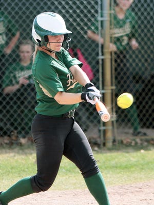 Mackenzie Gilmer, shown hitting a home run last month, has played a key role in Howell’s offense this season. The Highlanders take on Holt in a regional at Grand Ledge on Saturday.