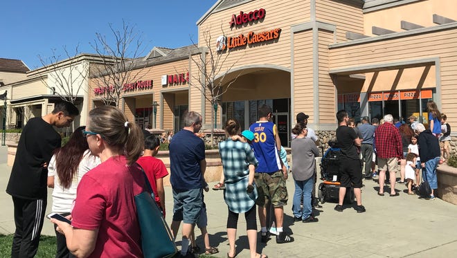 A promise of free pizza attracted a lot of people to the Little Caesars restaurants on Cypress Avenue and Lake Boulevard in Redding on Monday.