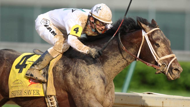 Calvin Borel and Super Saver hits the final stretch to eventually win the 2010 Kentucky Derby. (By Matt Stone, The Courier-Journal) May 1, 2010