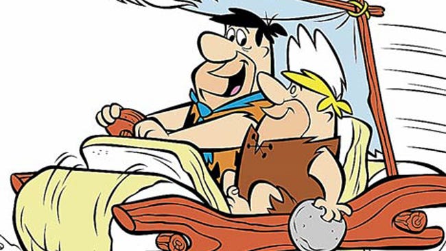 In an episode of "The Flintstones," Fred Flintstone (left) raced in the Indianrockolis 500 as Goggles Paesano.
