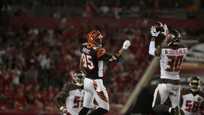 Tampa Bay Buccaneers strong safety Bradley McDougald (30) intercepts a pass intended for Cincinnati Bengals tight end Tyler Eifert (85) during the second quarter of the NFL pre-season game between the Cincinnati Bengals and the Tampa Bay Buccaneers at Raymond James Stadium in Tampa, Fla., on Monday, Aug. 24, 2015.
