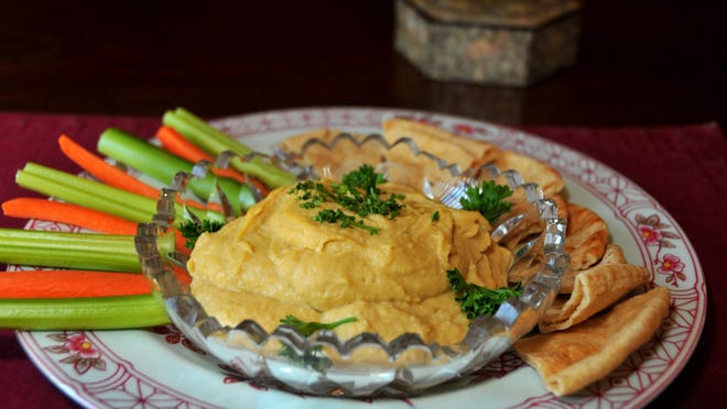 Hummus, made from chick peas, tahini, olive oil, garlic and lemon, has become a popular snack in the United States.