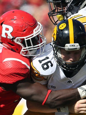 Rutgers takes on Iowa in their first Big Ten game of 2016 at High Point Solutions Stadium in Piscataway on Saturday September 24, 2016Rutgers # 15 (left)  Trevor Morris takes down Iowa's quarterback # 16 C.J. Beathard. 