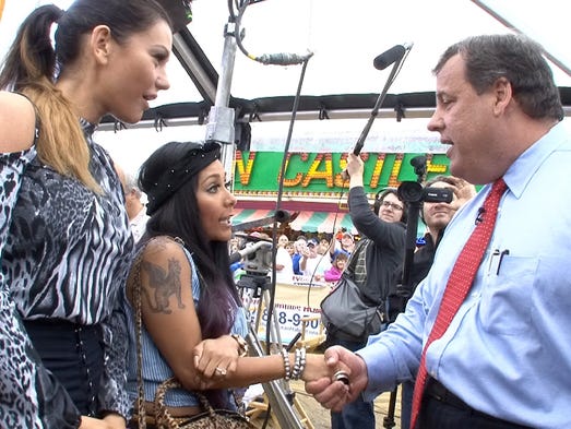 New Jersey Governor Chris Christie shakes hands with