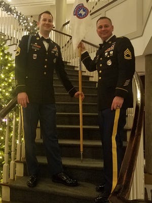Sergeant First Class Casey Cleveland (right) works at the Army Recruiting Center at 633 Main St. in Waltham.