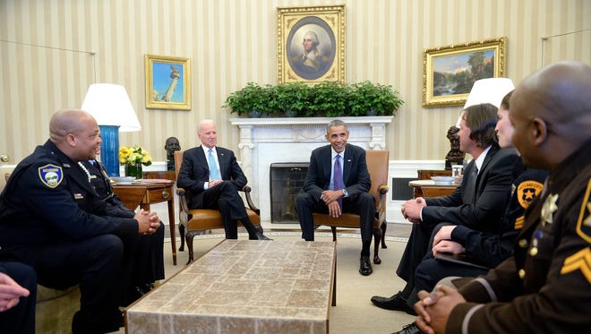President Obama and Vice President Biden meet with rank-and-file law enforcement officials in the Oval Office on Feb. 24, 2015.