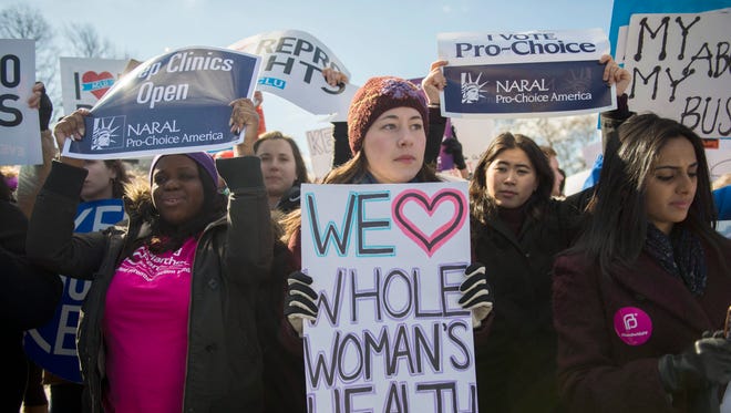 Abortion rights activists rally as the Supreme Court hears Whole Woman's Health v. Cole, the controversial Texas case that sought to limit access to abortions. The law was struck down.