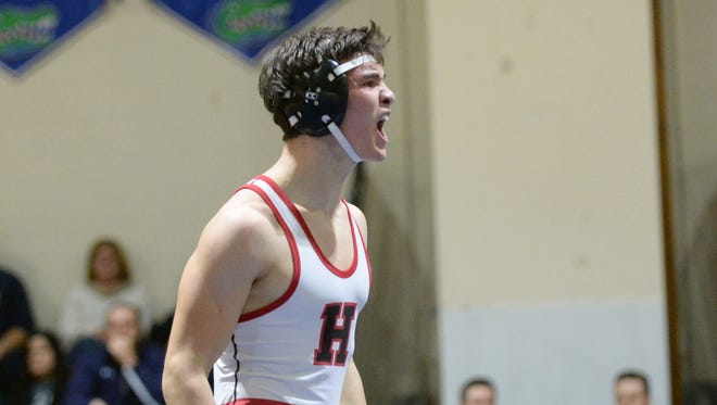 Haddonfield's Sean Ellery celebrates after pinning Gateway's Lucas DeSantis in the third period of the 160-pound bout of Friday night's wrestling match at Gateway.