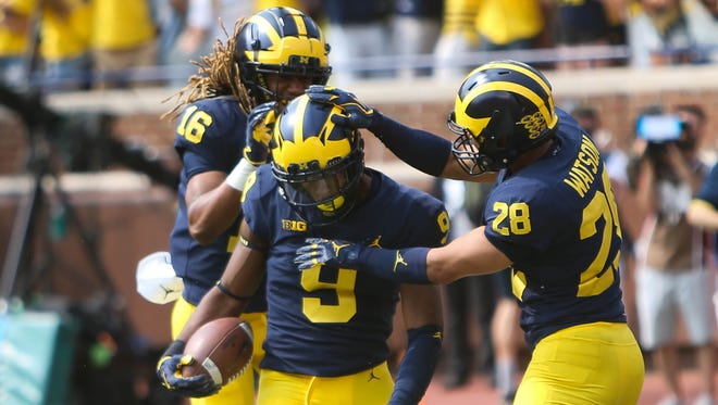 Michigan's Donovan Peoples-Jones (9) celebrates his 79-yard touchdown in the third quarter against Air Force with Jaylen Kelly-Powell, left, and Brandon Watson, Saturday, Sept. 16, 2017 at Michigan Stadium.