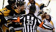 A referee separates Pittsburgh Penguins right wing