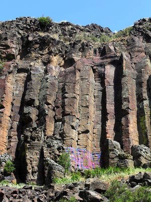 "Destiny, Prom?" painted in large pink and blue letters on the side of the Black Cliffs east of Boise.