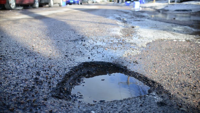A pothole on Grant Street in Burlington in spring 2016.