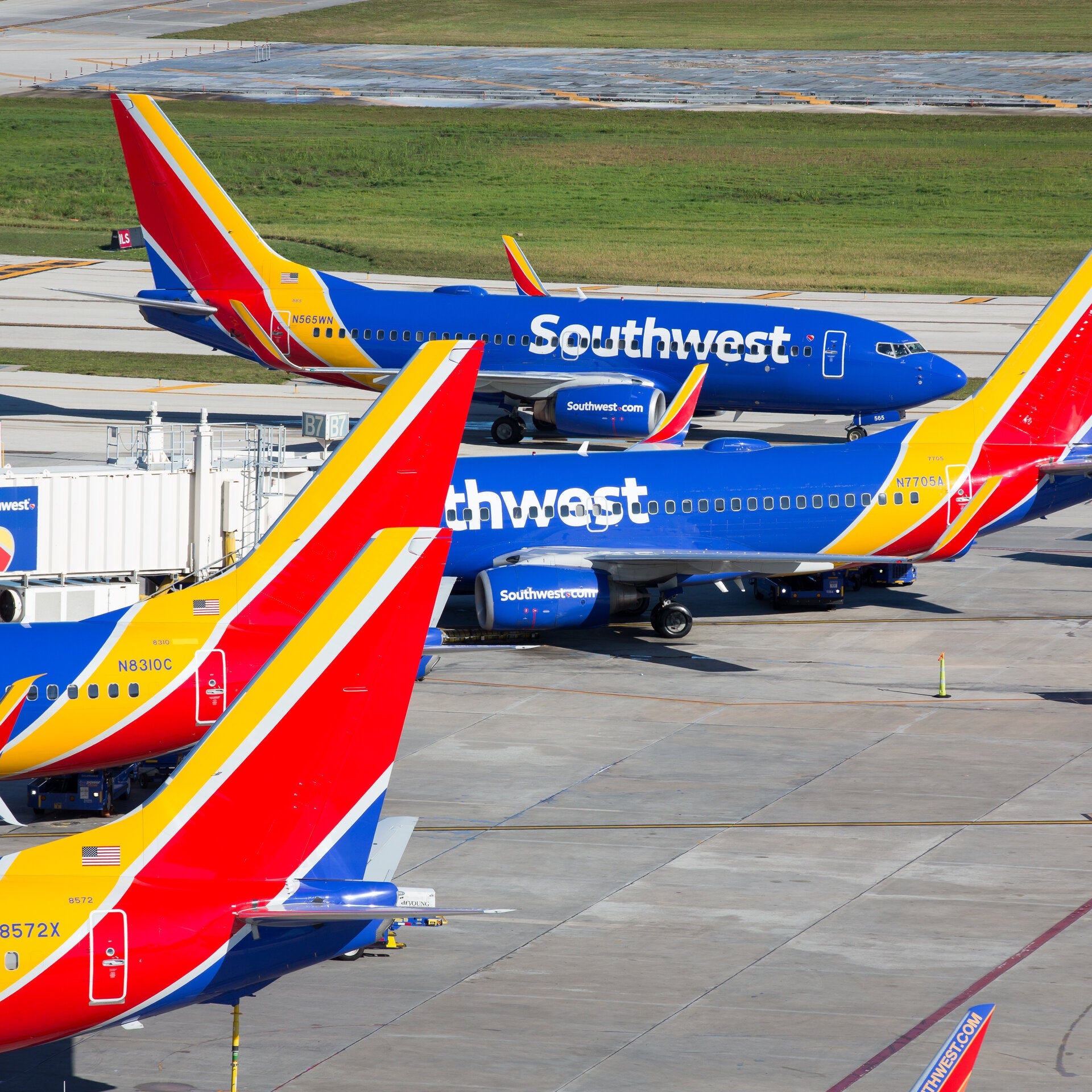 Southwest Airlines planes in an airport gate area.