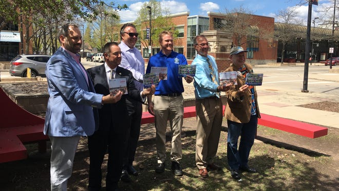 From left, On Broadway Director Brian Johnson, Mayor Jim Schmitt, CVB CEO Brad Toll, Green Bay Parks Director James Andersen, Downtown Green Bay Executive Director Jeff Mirkes and Alderman Randy Scannell show off the 2018 summer events guide.