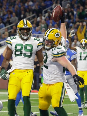 Green Bay Packers fullback Aaron Ripkowski spikes the ball after his touchdown run.
