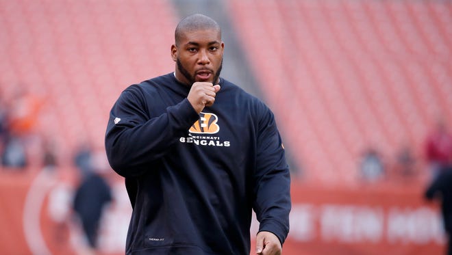 The Cincinnati Bengals defensive tackle Devon Still (75) keeps his hands warm prior to their game against the Cleveland Browns at FirstEnergy Stadium.